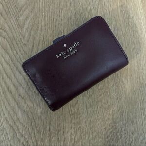 kate spade burgundy leather compact wallet with gold logo